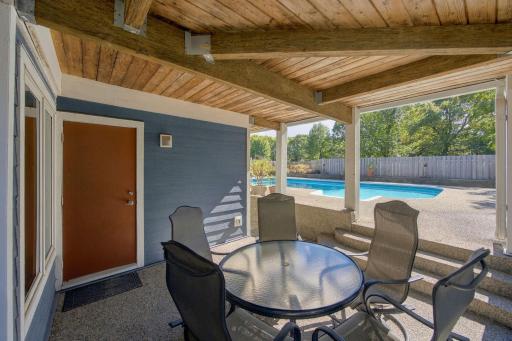 48- Covered seating area just off lower level family room.