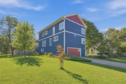 Architecturally distinctive three-story home with a finished basement, extensive updates, and a private fenced pool area designed for entertaining and recreation.