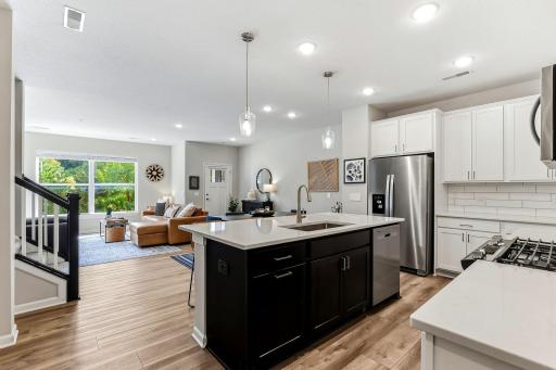 Open kitchen flows right into the living area, with plenty of natural light and peaceful views outside.