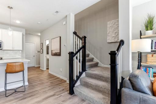Stairway to the upper level with modern railing.