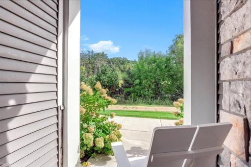 Enjoy a peaceful setting overlooking the ponds and trees, offering a relaxing view right outside your front door.