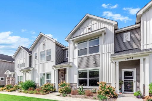 Like-new 3-bedroom, 3-bath townhome featuring a bright, modern exterior, inviting entry, and beautiful curb appeal. Enjoy low-maintenance living in a stylish home that feels fresh, welcoming, and move-in ready.