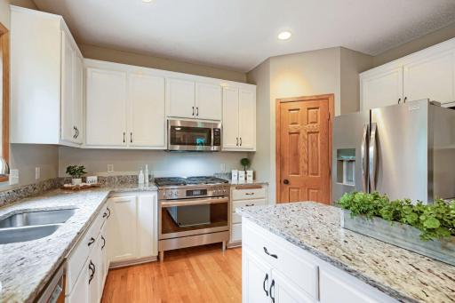 Beautiful stainless steel appliances include a gas range.