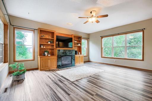 Built-in cabinets surround the gas fireplace.