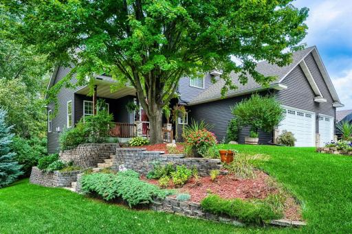 Along the side yard of this lovely home, a walking path leads to the Vermillion Falls and Vets Park.