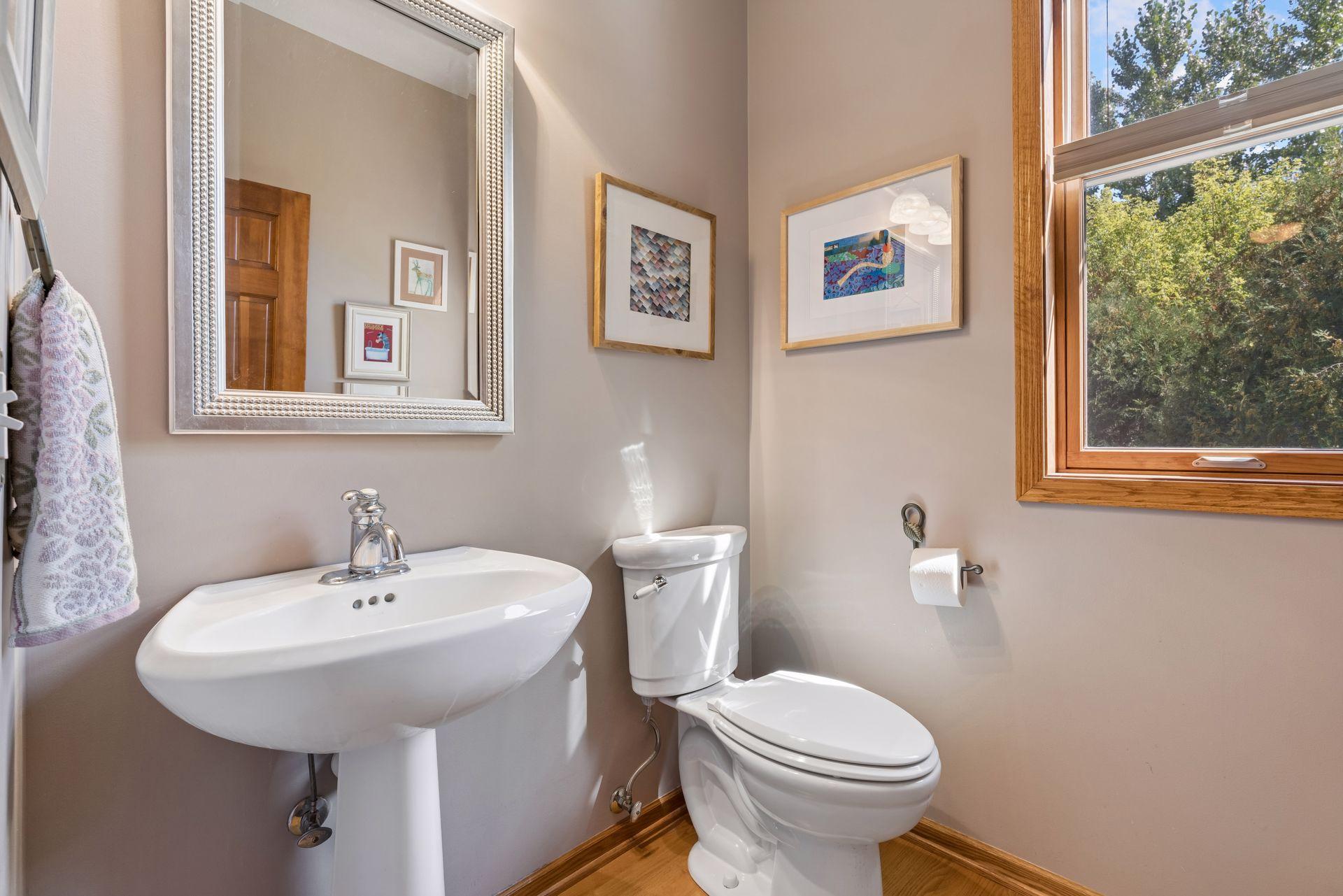 Main-floor powder room with pedestal sink