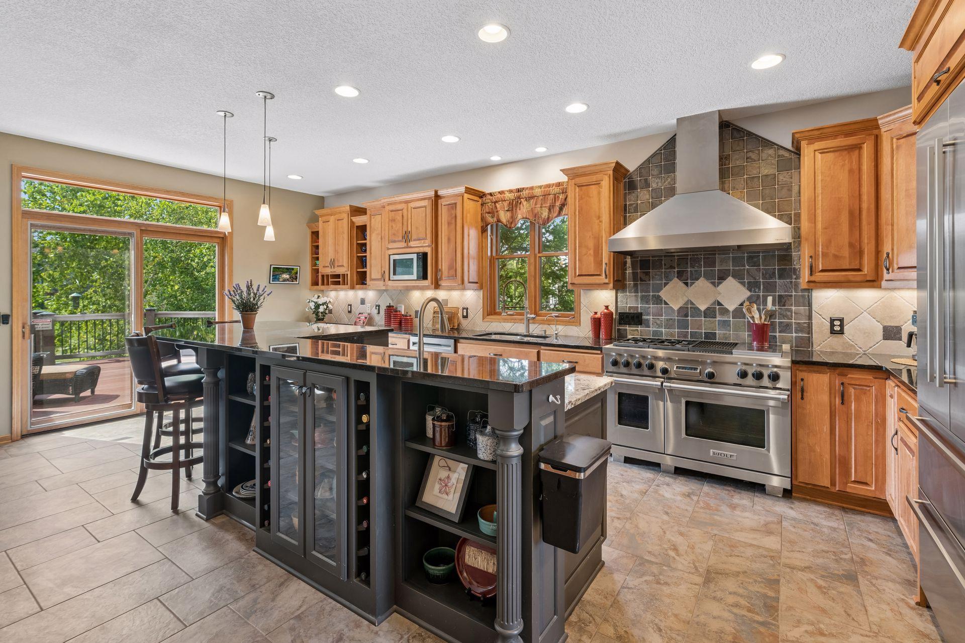 Wolf range, granite counters and maple cabinetry