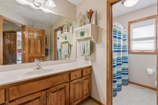Upper full bath with separate vanity and tub room