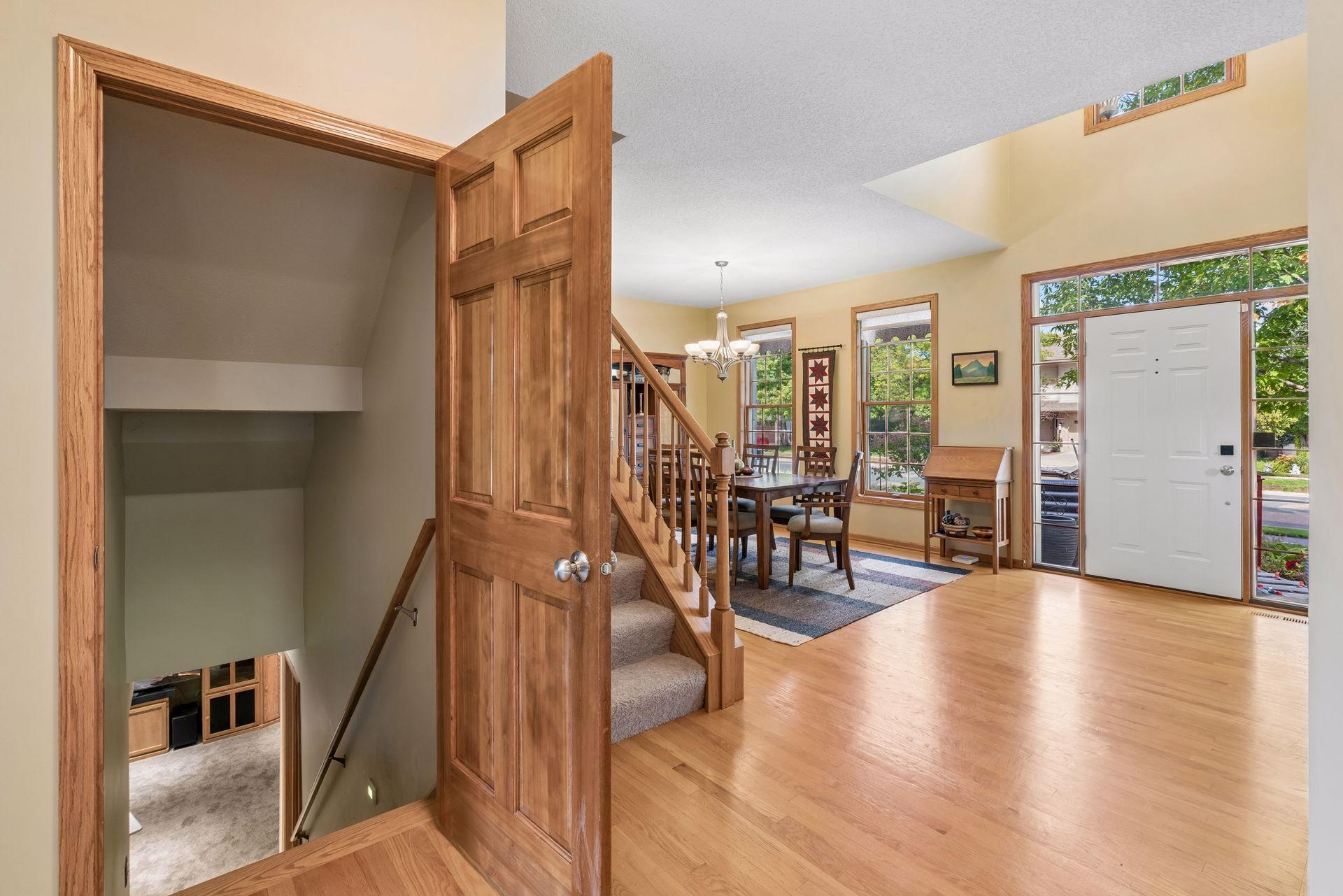 Hardwood entry with stairs to the lower level