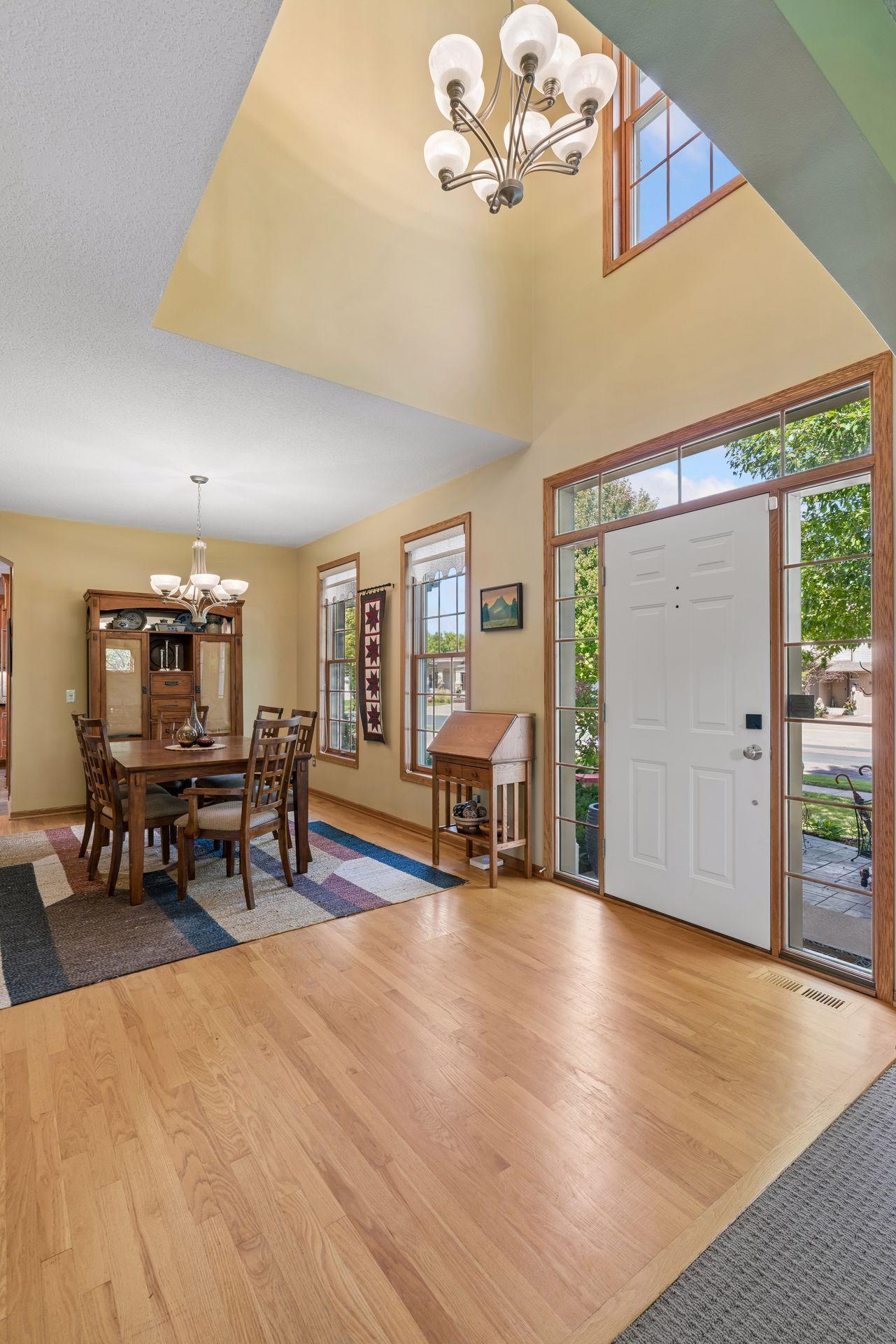 Two-story foyer with oak hardwood floors