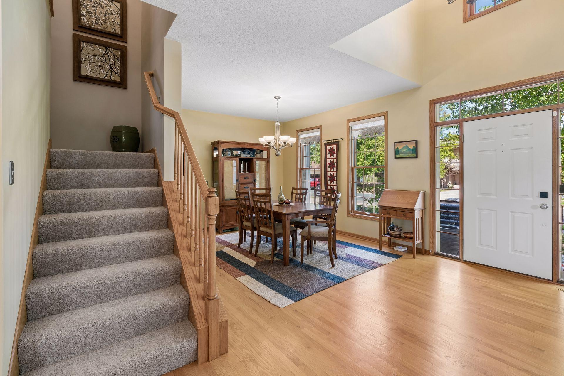 Oak hardwood entry with dining room and stairs