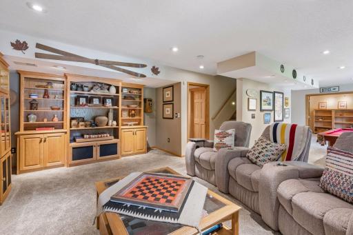 Lower level family room with built-in shelving