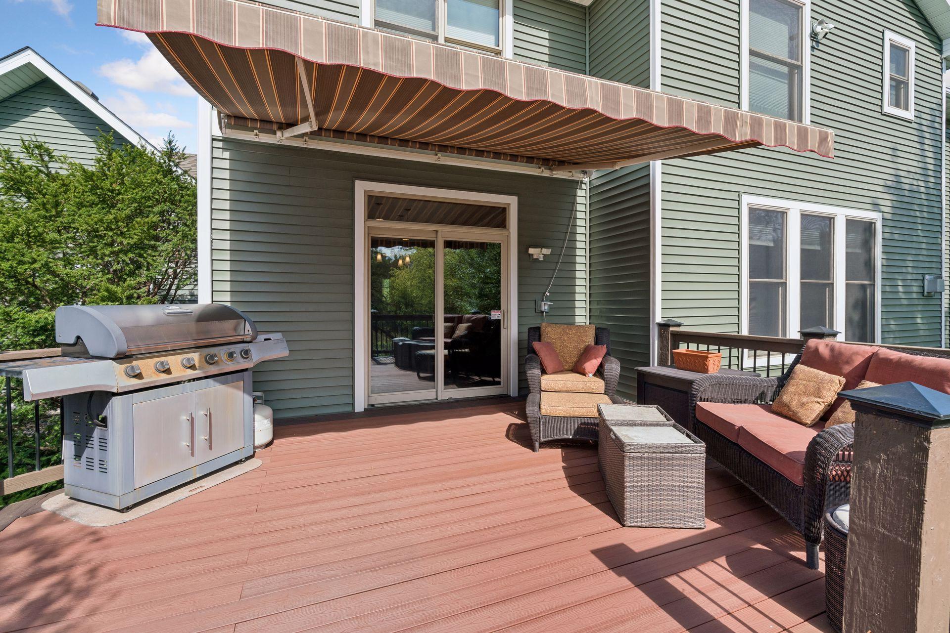 Deck with awning and sliding door to the kitchen
