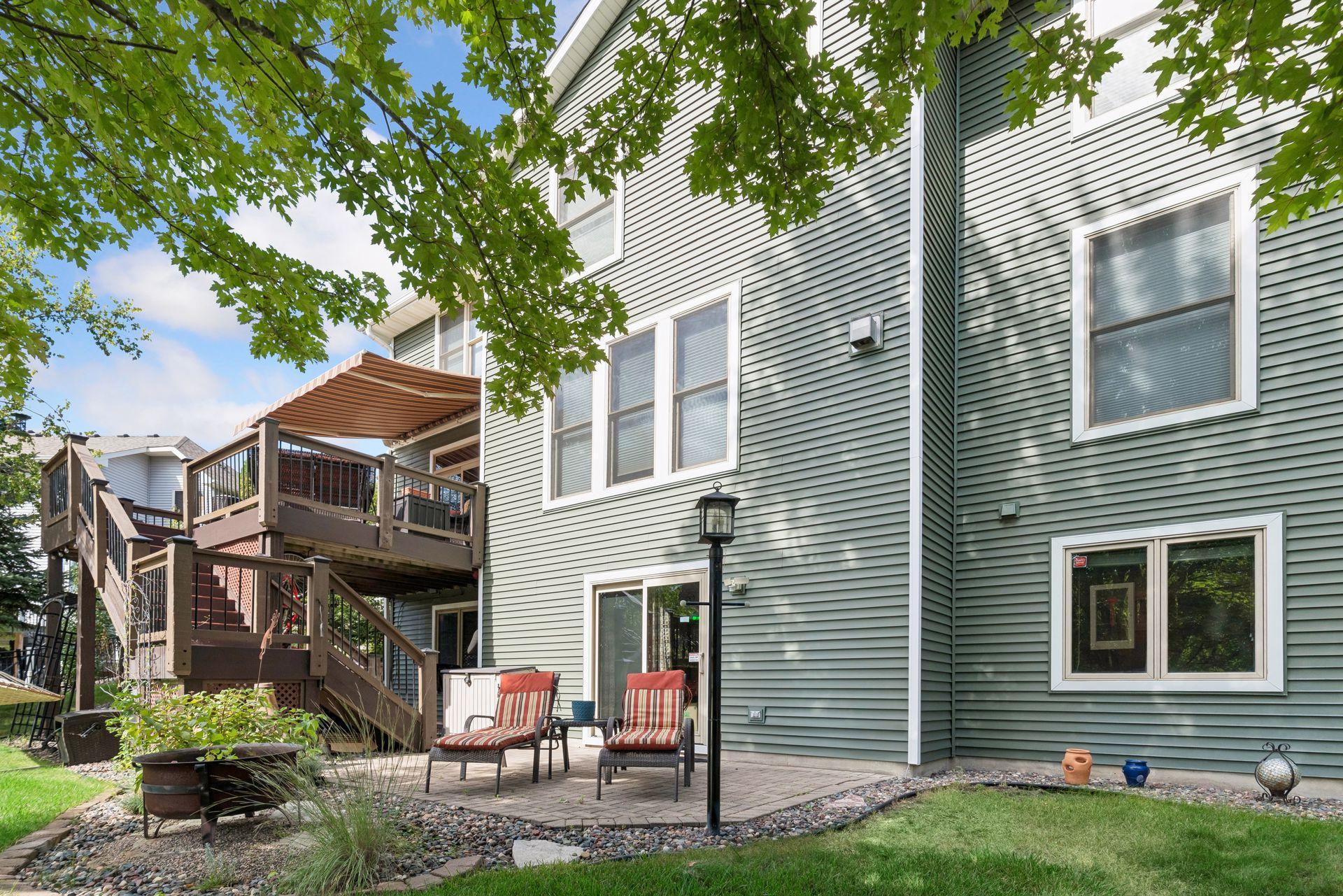 Two-level deck above a paver patio and fire pit