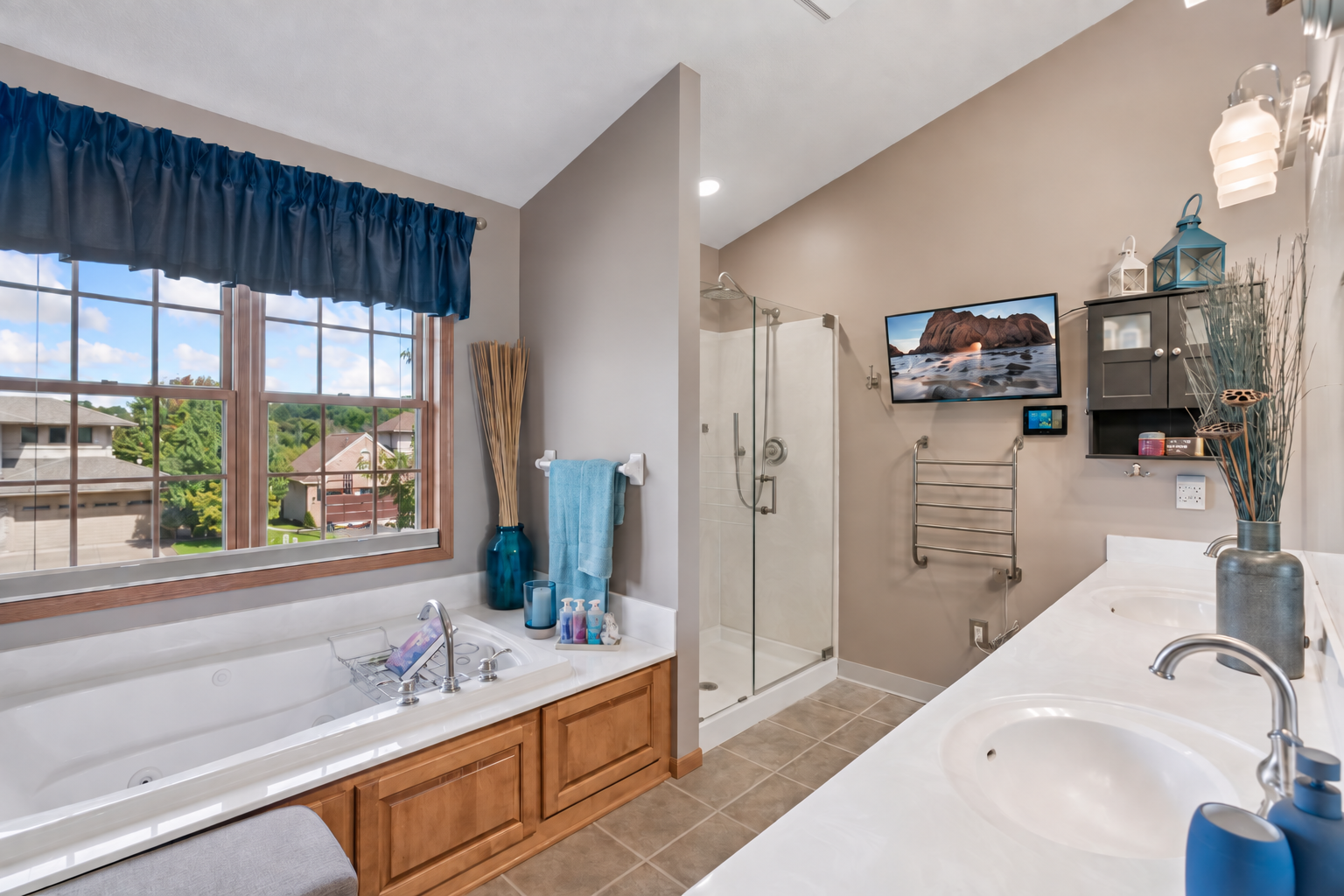 Primary bath with jetted tub and glass shower