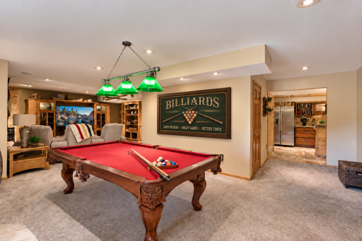 Billiards room open to the lower level bar