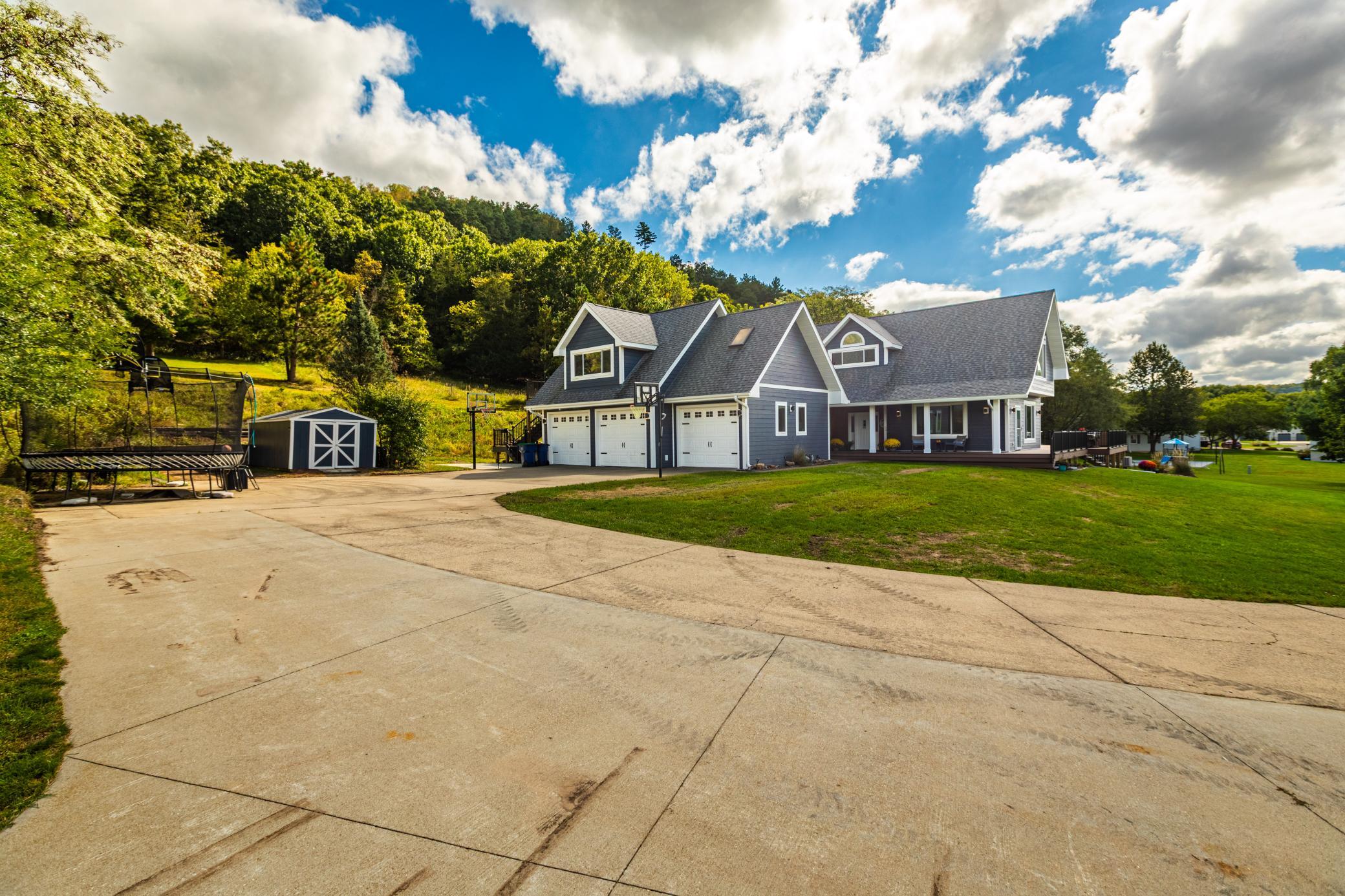 HUGE WRAP AROUND DRIVEWAY TO 3 CAR GARAGE