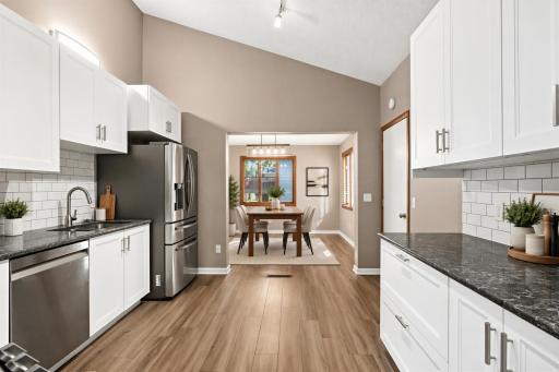 Updated kitchen into informal dining room - virtually staged