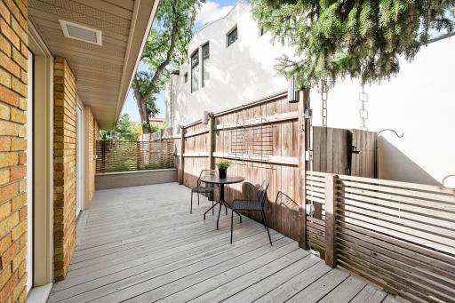 Side deck with door from kitchen and sliding door from dining room