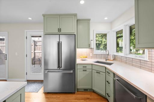 Corner window with a great view, door to deck, large fridge