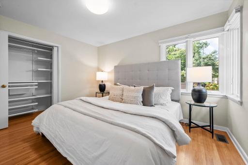 One of 2 bedrooms on the main floor, oak floors