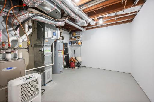 Large storage room and utility area, new water heater