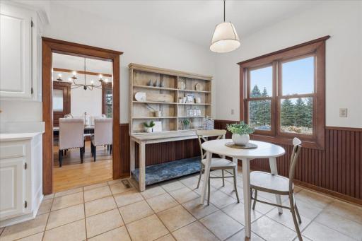 Charming breakfast area offers a comfortable gathering space just off the kitchen.