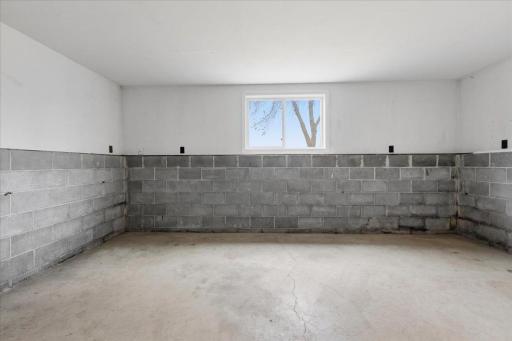 Storage/workspace off the garage space. (Under the three-season room)