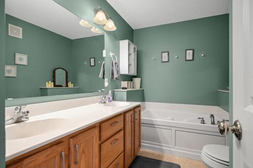 Private Primary Bath features a double-sink vanity and separate soaking tub and shower.