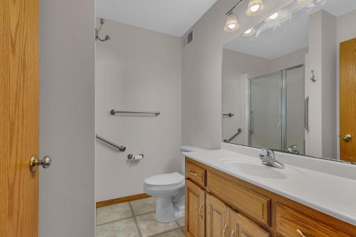 Nice sized vanity and grab bars in the 3/4 guest bath