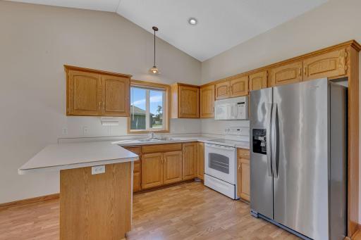 A well-equipped kitchen with nice breakfast bar ideal for informal gatherings