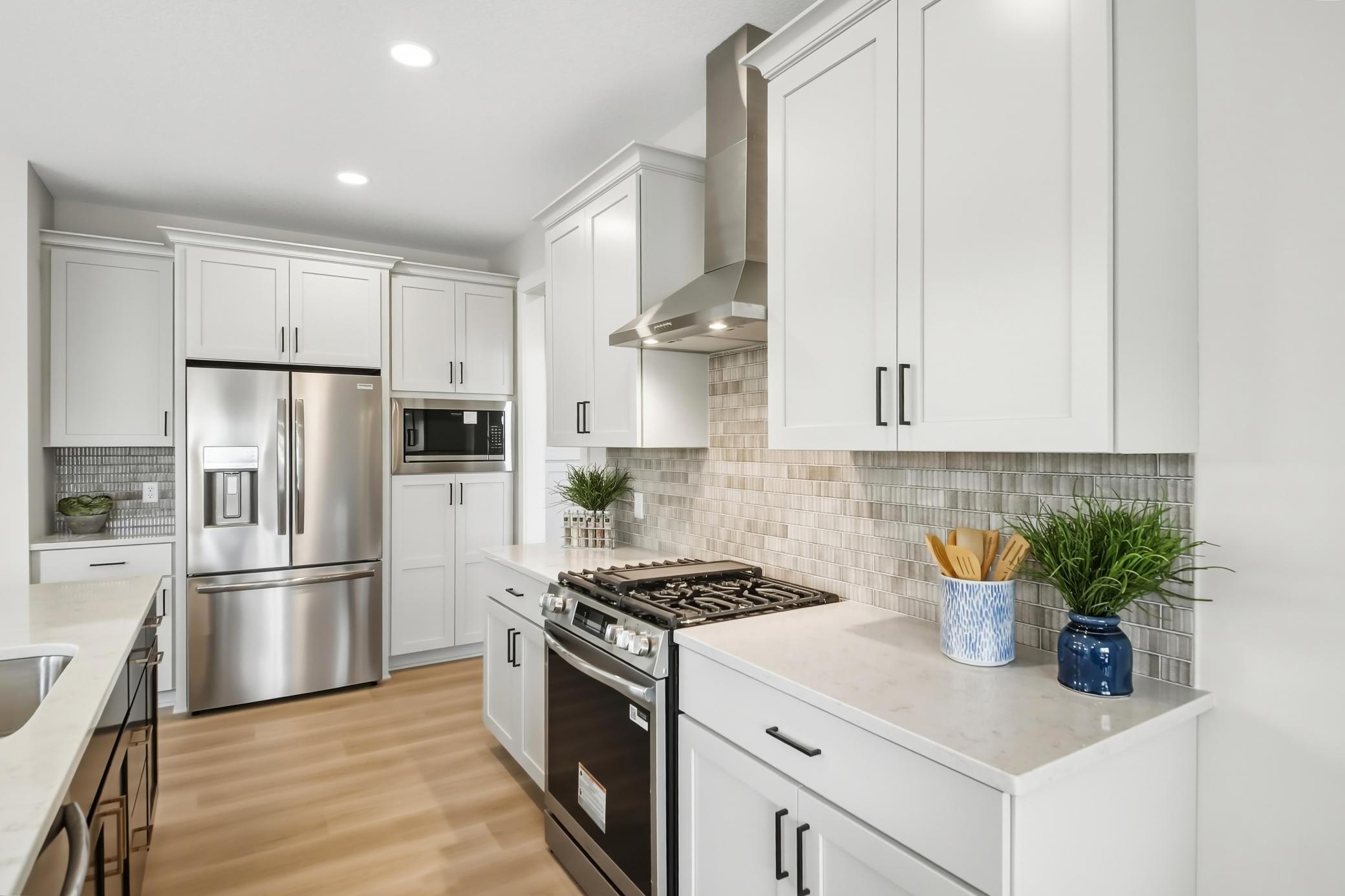 Gas oven with metal hood vent