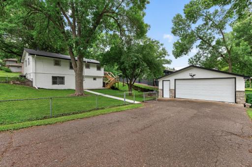 This corner lot has a second driveway to an oversized 2 car garage. Rear yard is fully fenced.