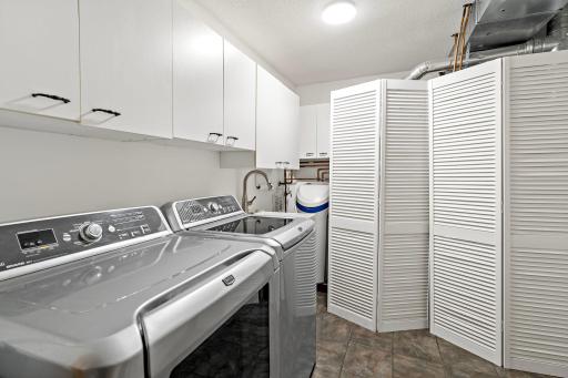 Large laundry area. Houses mechanicals and door to garage for easy access.