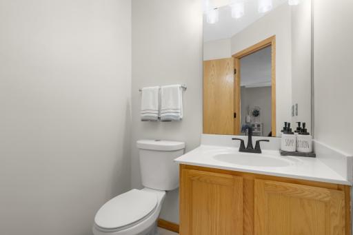 Main floor powder room bath offers LVT flooring.