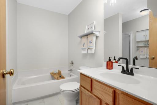 Relax and enjoy this soaking tub, spacious vanity and LVT flooring.