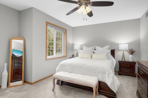 Upper level oversized primary bedroom with plenty of space for all furniture.