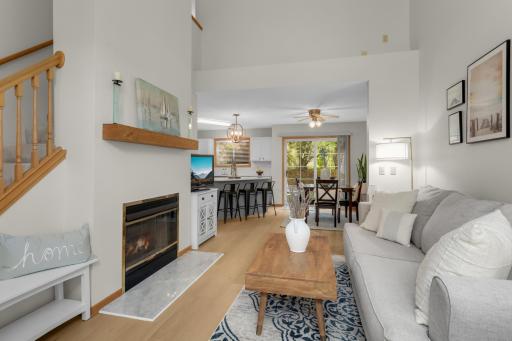 Stunning living room that offers gas fireplace wall with custom mantle.