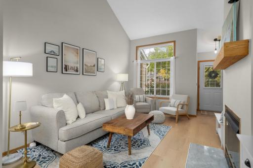 Gorgeous LVP flooring in living room, dining and kitchen.