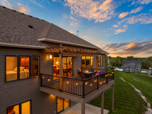 Elevated maintenance-free deck with pergola offers a wonderful outdoor entertaining space and peaceful views of the surrounding neighborhood and green space.