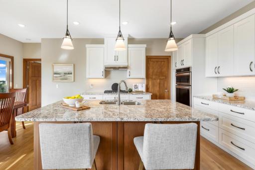 The heart of the homeâplenty of room to cook together, pull up a seat at the oversized island, and enjoy everything from morning coffee to casual gatherings.