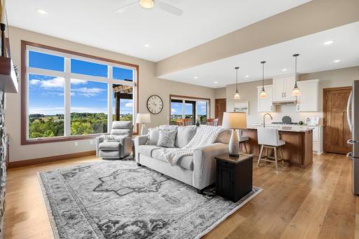 Open-concept living at its bestâgather by the fire, cook and entertain in the kitchen, all while enjoying beautiful views through the expansive windows.