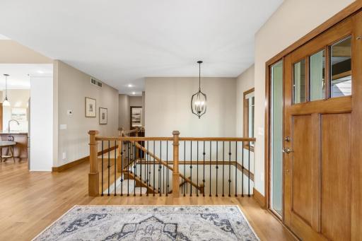 Just off the entry, the hallway leads to the primary suite, mudroom, and garage, creating a convenient and functional main-level layout.