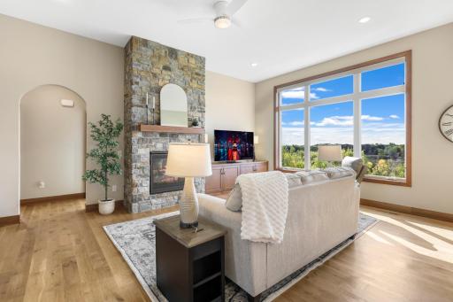 Cozy up by the stone fireplace, unwind with a favorite show, and enjoy the beautiful viewsâthis great room was made for relaxing.