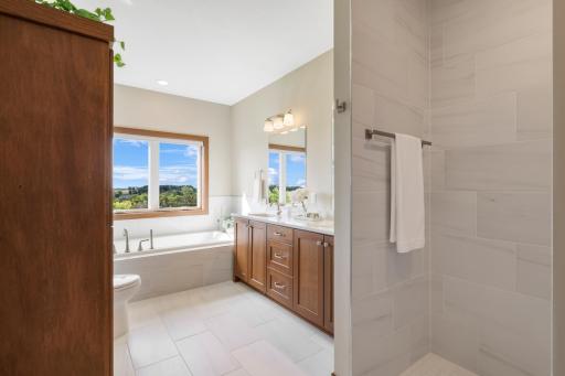Your own private retreatâsoak in the tub while taking in the beautiful views, or unwind in the spacious walk-in tile shower.