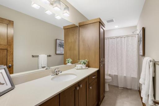 A spacious lower-level full bath conveniently serves both lower-level bedrooms, creating a private and comfortable retreat for family or overnight guests.