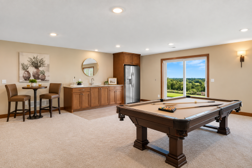 Made for entertainingâshoot a game of pool, pull up a seat at the wet bar, and enjoy walkout access with those incredible views as the backdrop.