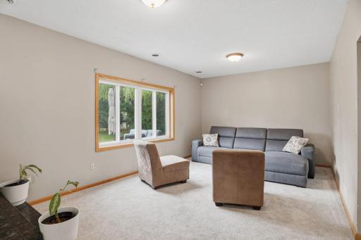 Movie nights and lazy Sundays belong in this lower level family room, wide windows overlooking the backyard and soft neutral tones ready for your own furniture.