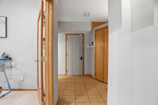 Come home through a mudroom that works as hard as you do. Tile flooring leads from the garage entry past a built in closet toward the main living spaces.