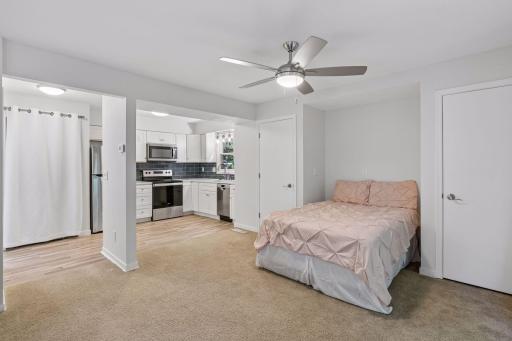 Bedroom space with closets are built into the wall. Some people have used a murphy bed, but why hassle with that...just keep the space open and usable!